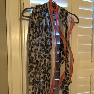 Loft light weight scarf in shades of black and grey on cream trimmed in pink.